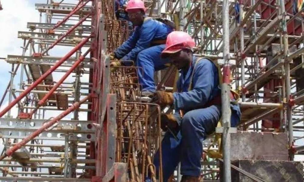 Engineering team supervising building construction