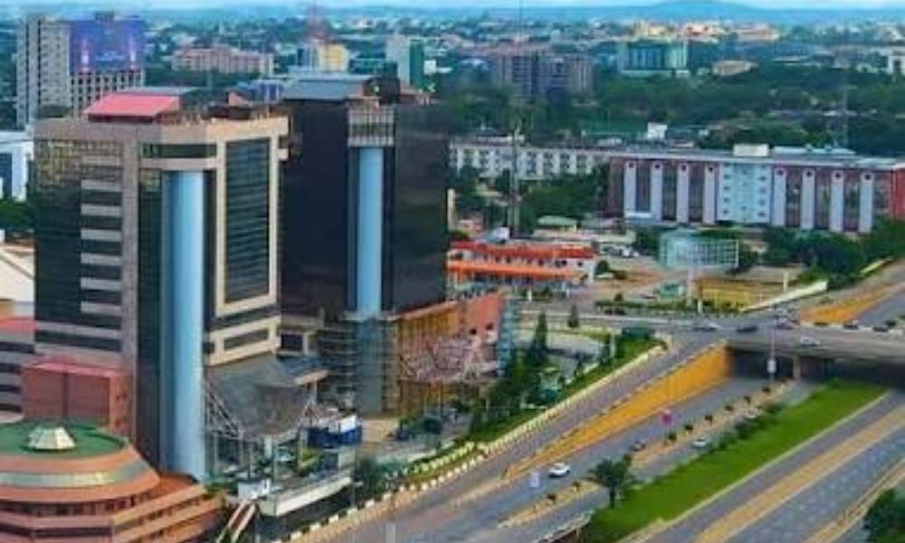 Aerial view of real estate investment in Abuja skyline at sunset